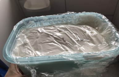 Batch of RI in a container covered with food wrap